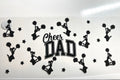 Cheer Dad decal with cheerleader silhouettes pom poms and stars in black