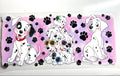 Spotty dalmatian pups with sunglasses decal on pink paw print background