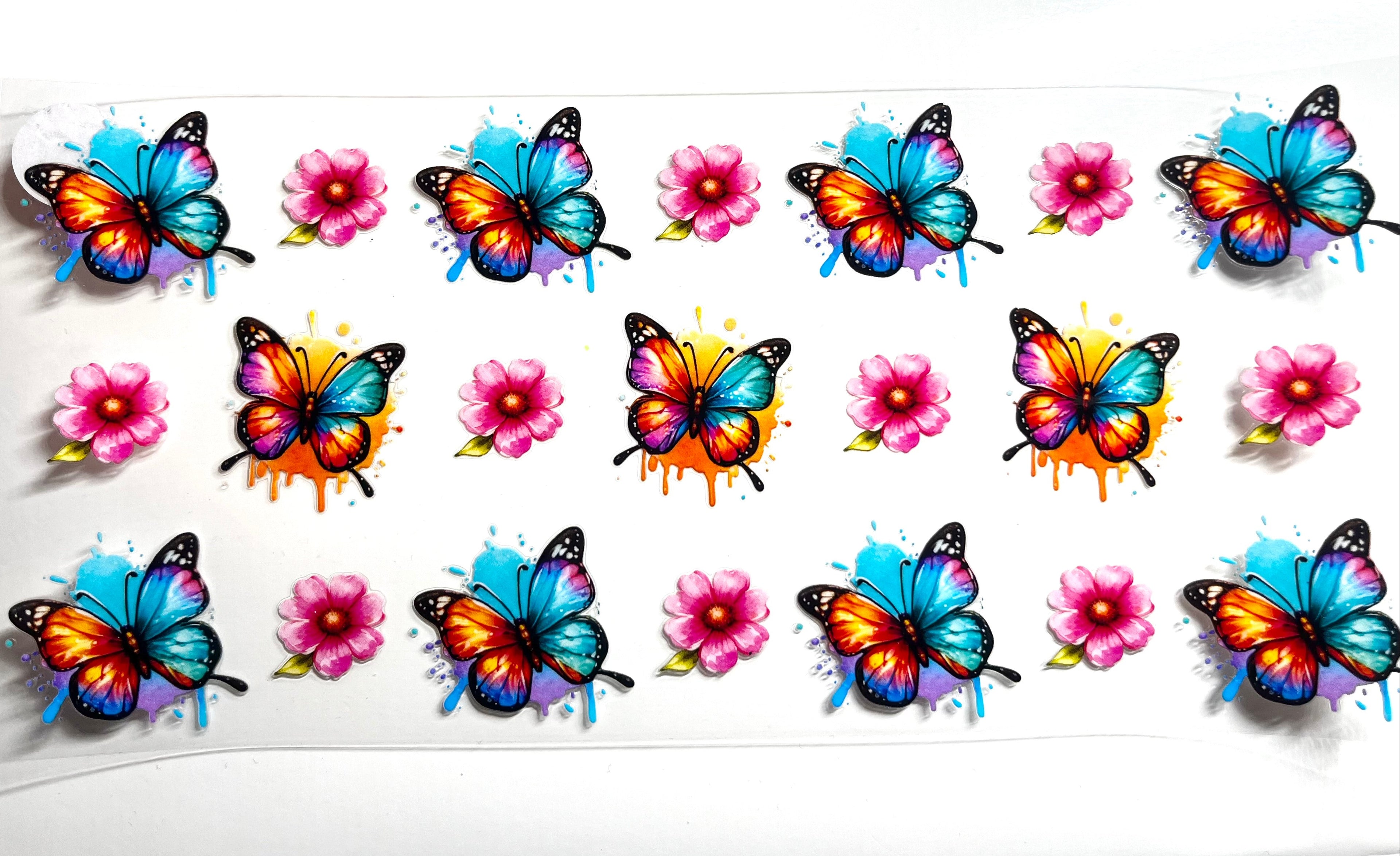Watercolor butterflies and pink blooms decal with vibrant orange blue and purple wings and paint splash accents