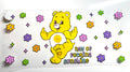 Ray of sunshine yellow bear decal with groovy retro flowers sparkle stars and sun belly badge
