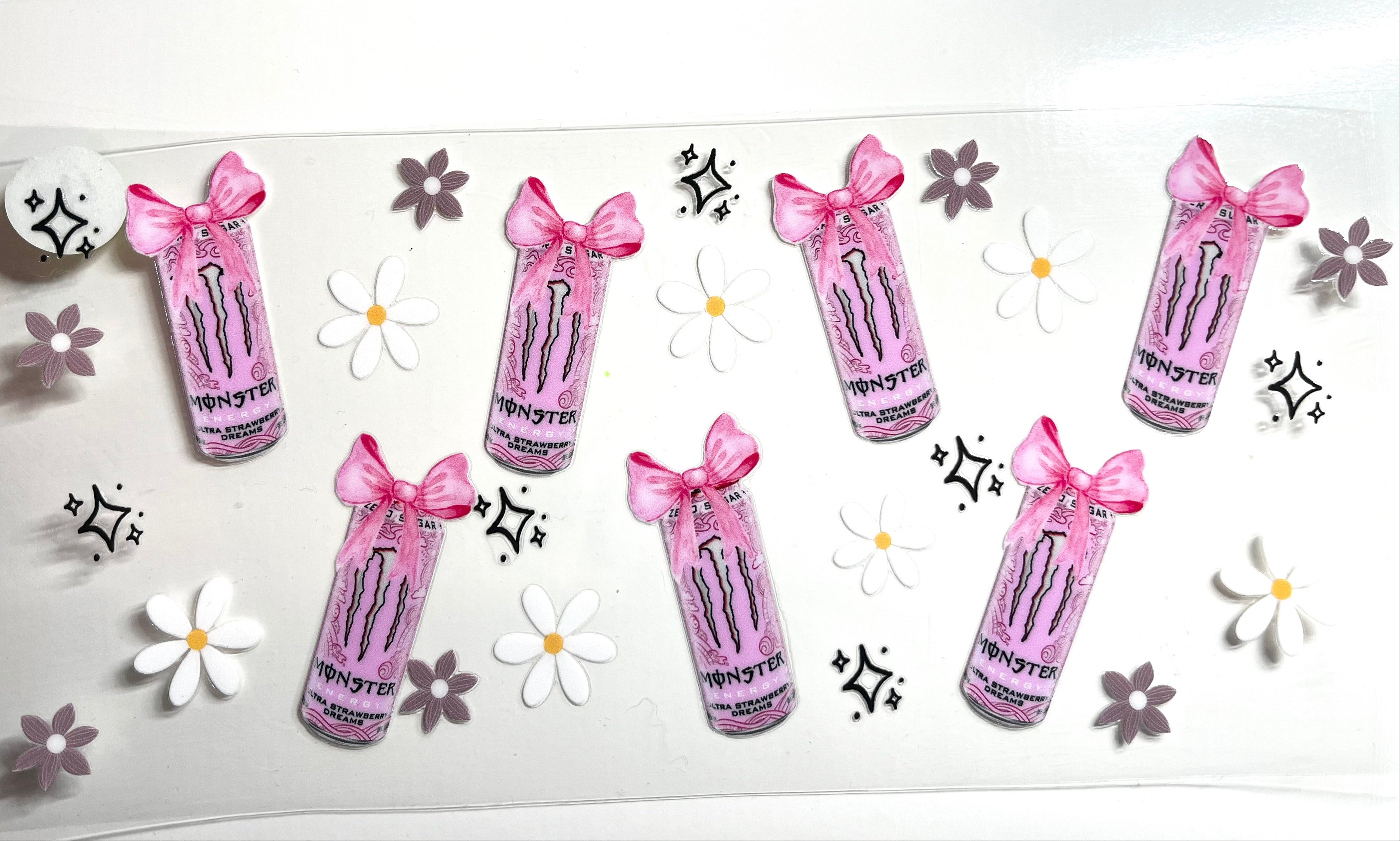 Pink energy drink cans with pink bows white daisies and sparkle stars decal