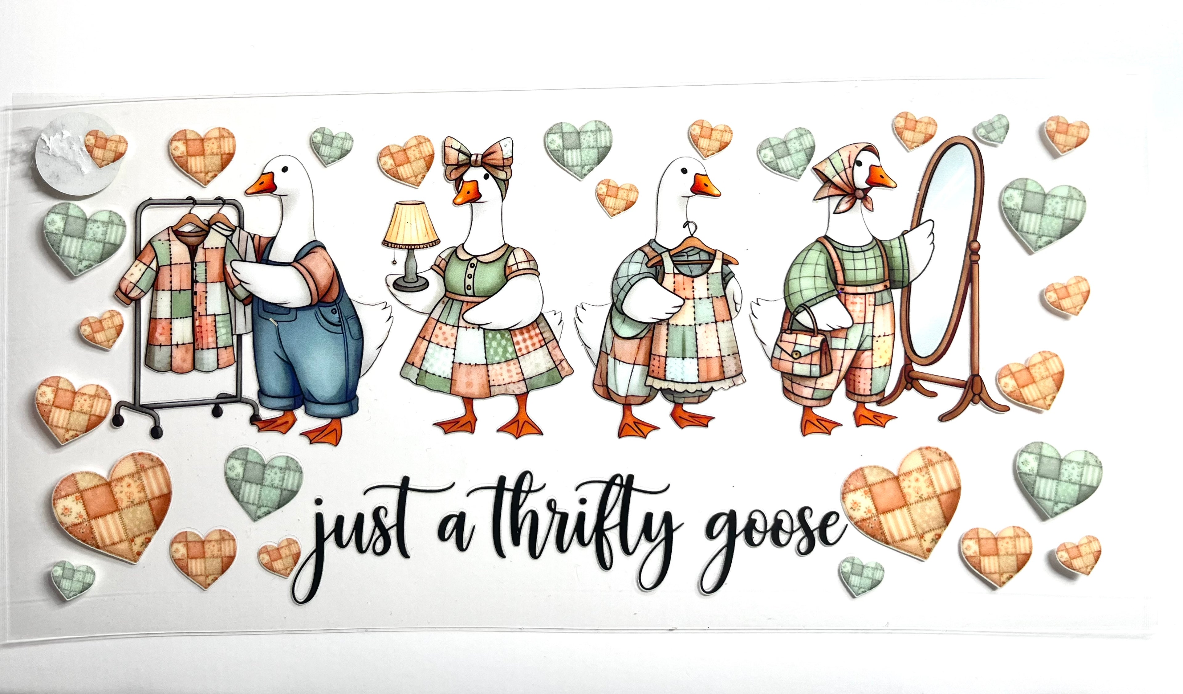 Just a Thrifty Goose decal with cottagecore geese shopping for clothes patchwork hearts and vintage mirror