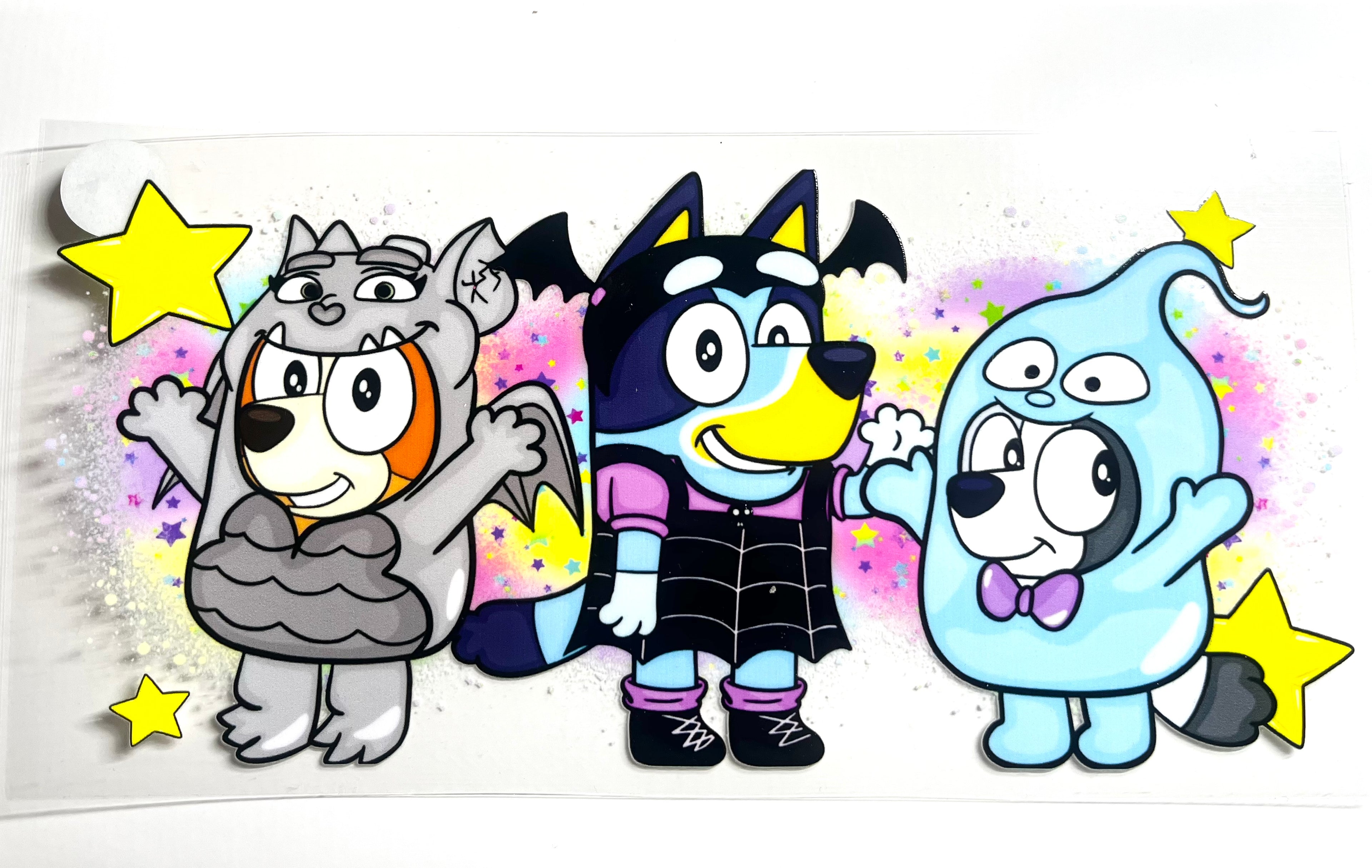 Halloween Bluey, Bingo, and Muffin decal in wolf, vampire bat, and ghost costumes with stars