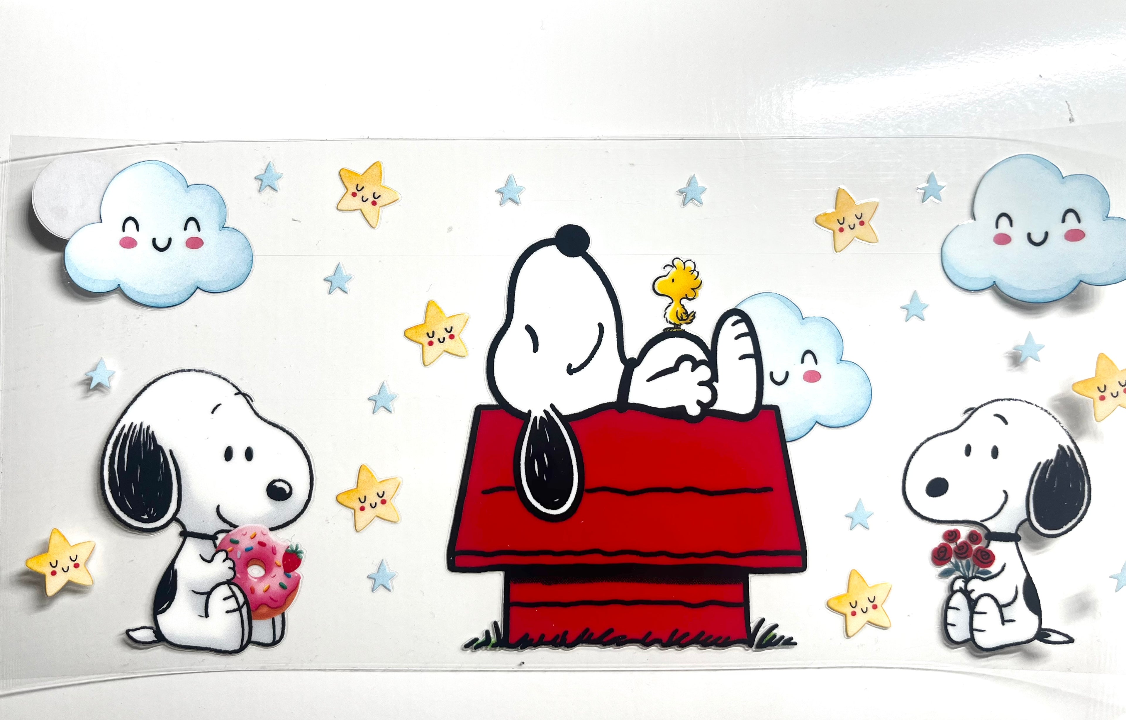 Snoopy and Woodstock on red doghouse with stars and clouds decal, Snoopy with donut and flowers